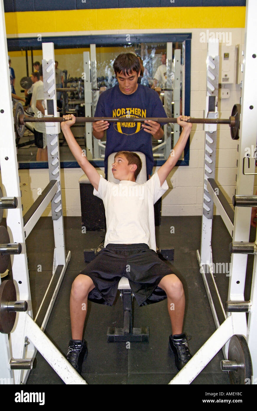 High school student work out lifting weights in a weight training class Stock Photo Alamy