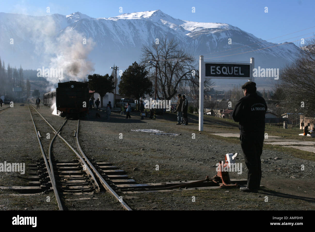 Old steam train La Trochita operator in the station of the town of Esquel, Chubut, Patagonia, Argentina. He is about to change t Stock Photo