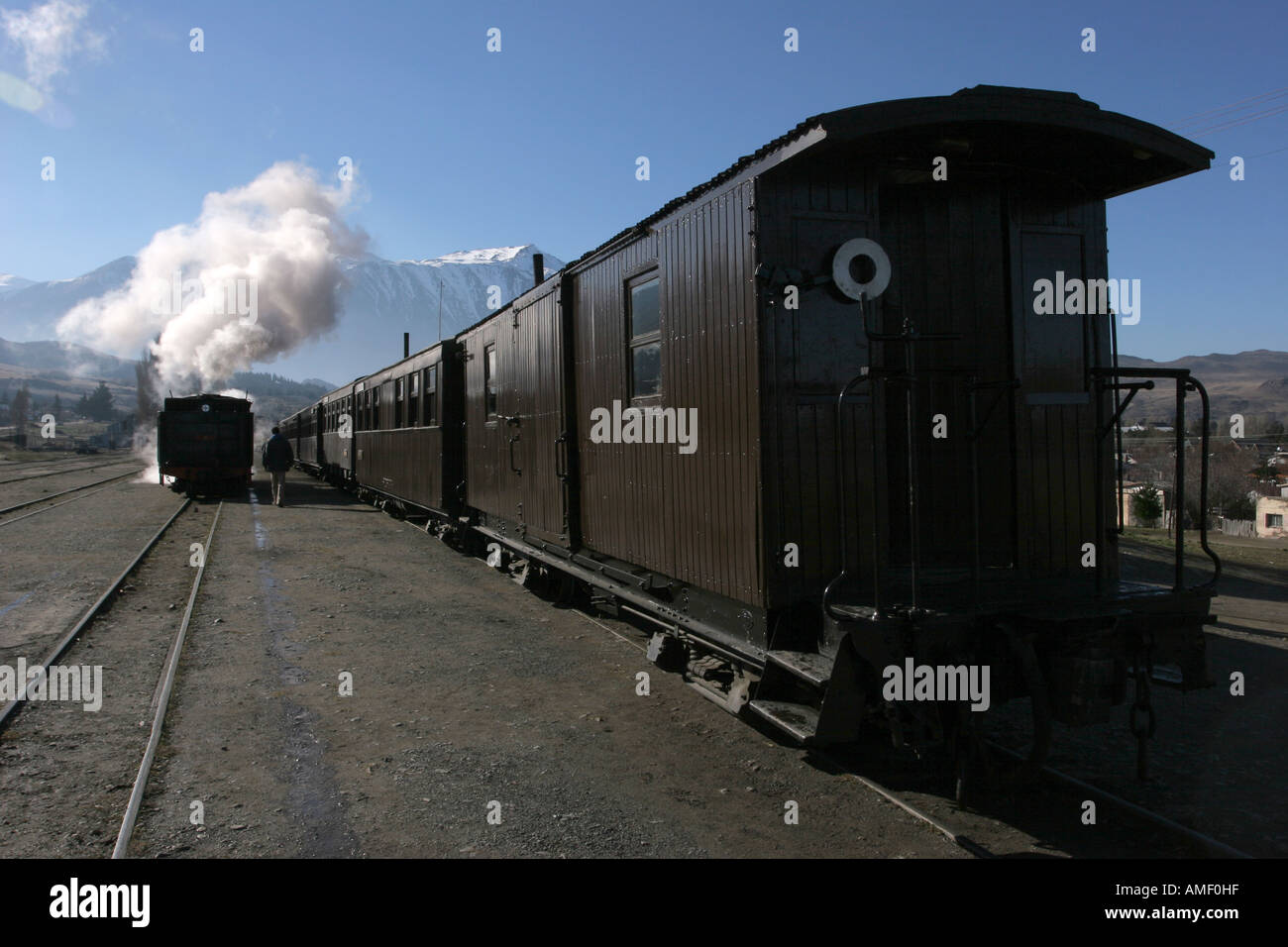 Old steam train La Trochita leaving the station of the town of Esquel, Chubut, Patagonia, Argentina, and throwing a lot of steam Stock Photo