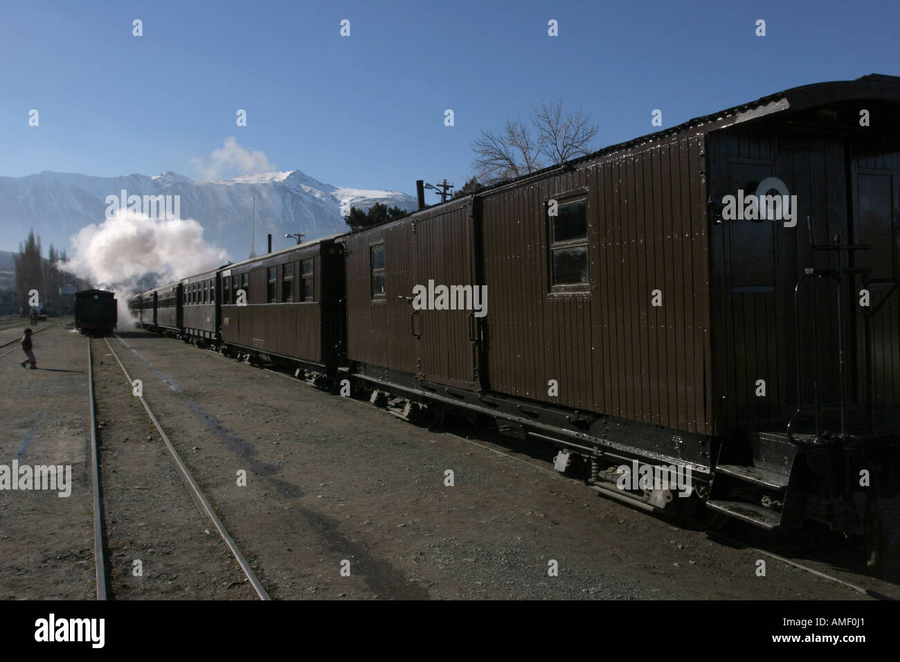 Old steam train La Trochita leaving the station of the town of Esquel, Chubut, Patagonia, Argentina, and throwing a lot of steam Stock Photo