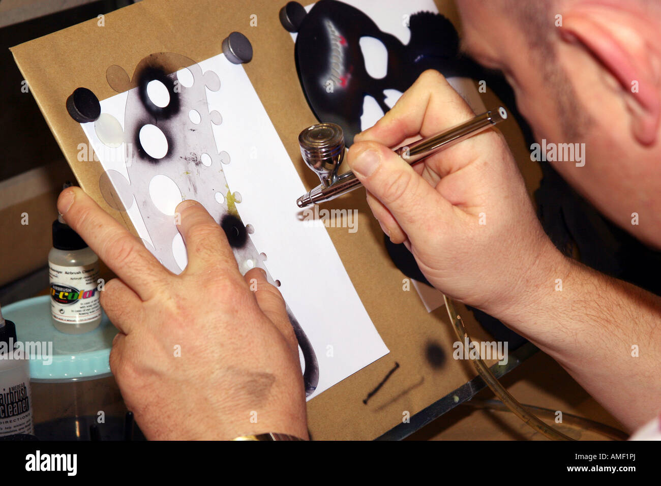 Man using high quality artists airbrush. Stock Photo