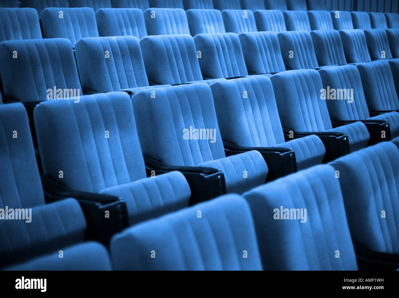 Empty chairs at cinema or theater. Blue tone. Stock Photo