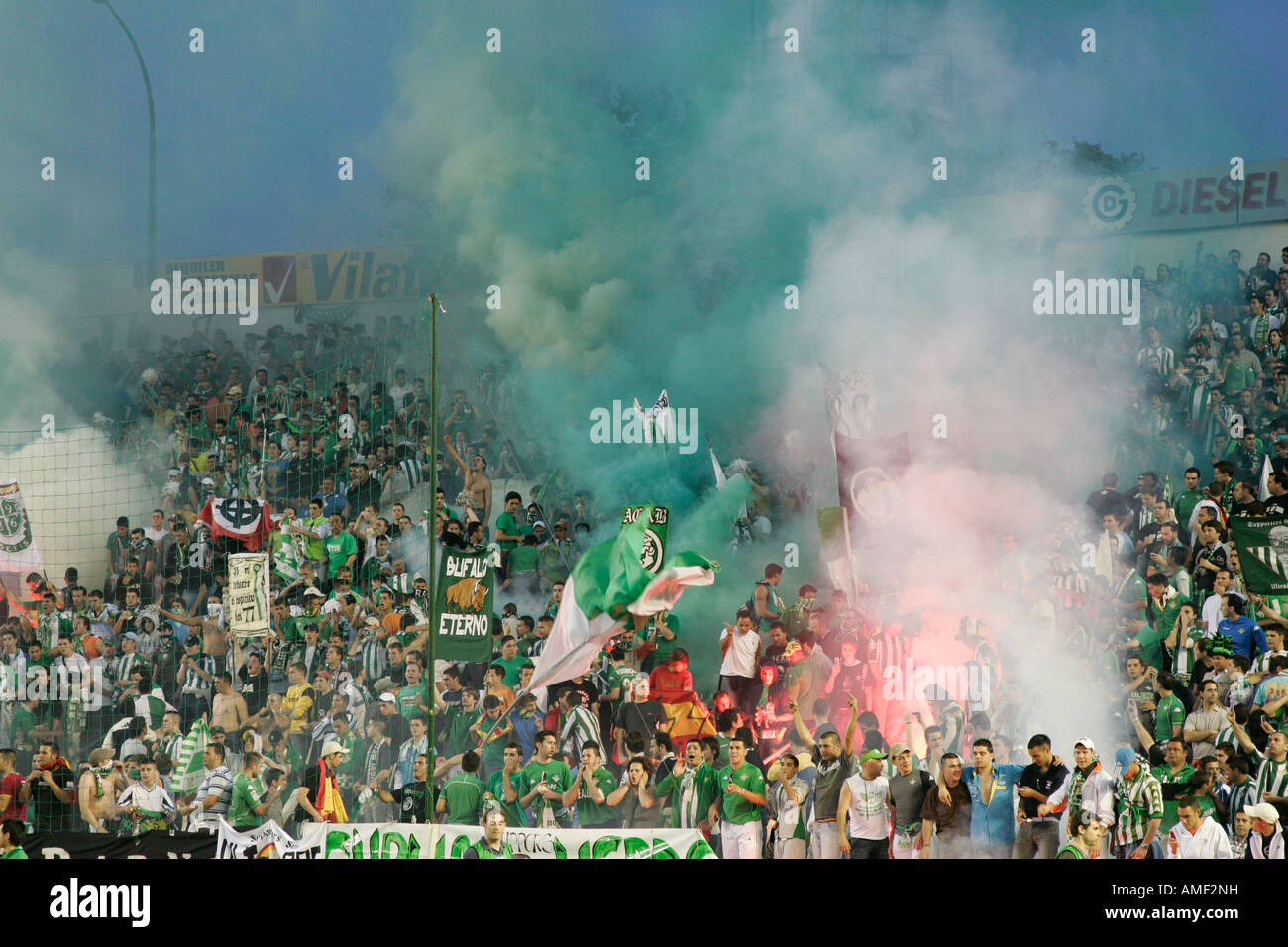 Real Betis fans firing flares. Stock Photo