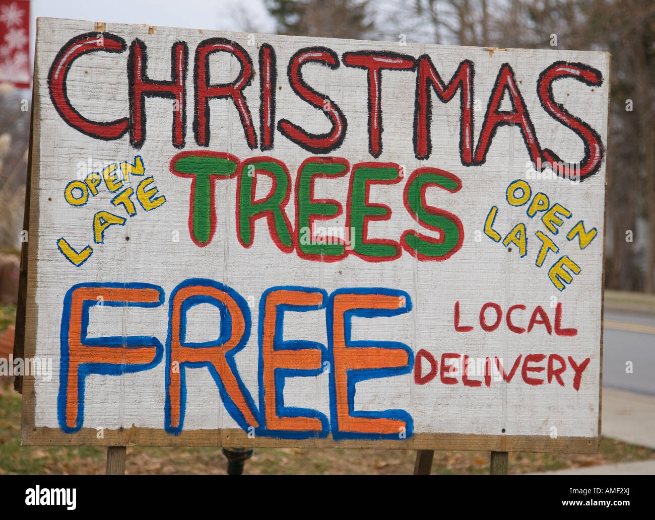 Sign outside a place selling Christmas trees Stock Photo Alamy