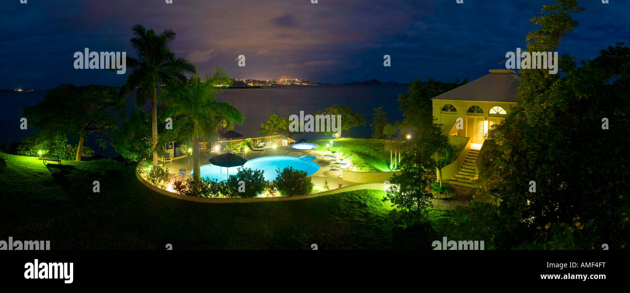 Night shot of the pool at a luxurious Caribbean resort at Gallows Point, St. John, US Virgin Islands with Red Hook on St. Thomas Stock Photo