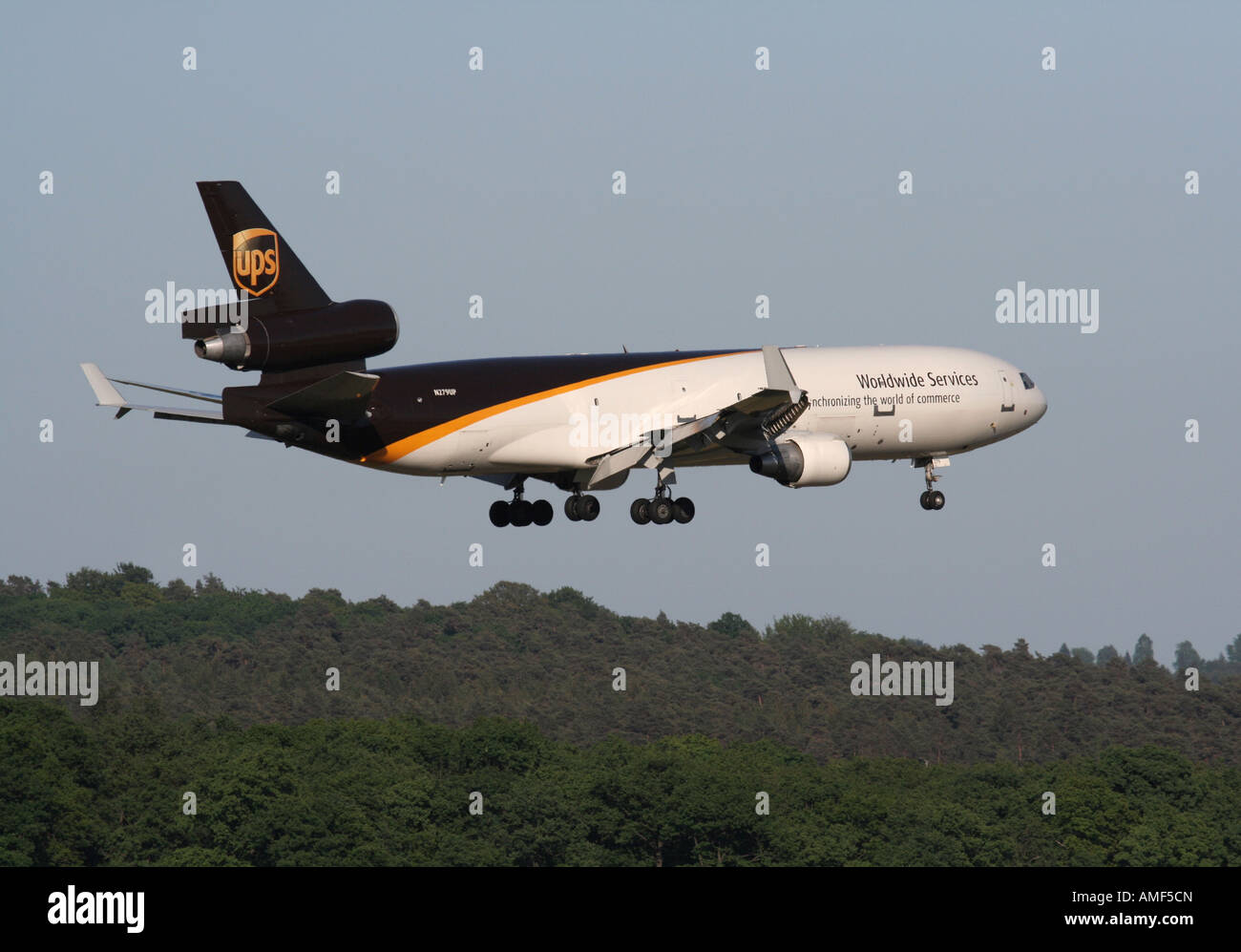 Commercial air transport. McDonnell Douglas MD-11F cargo jet plane operated by UPS on approach to Cologne/Bonn Airport, Germany Stock Photo