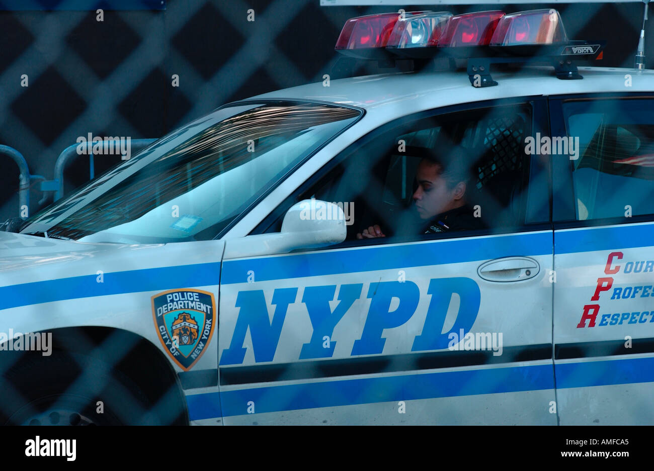 New York City Police Officer in his vehicle Stock Photo