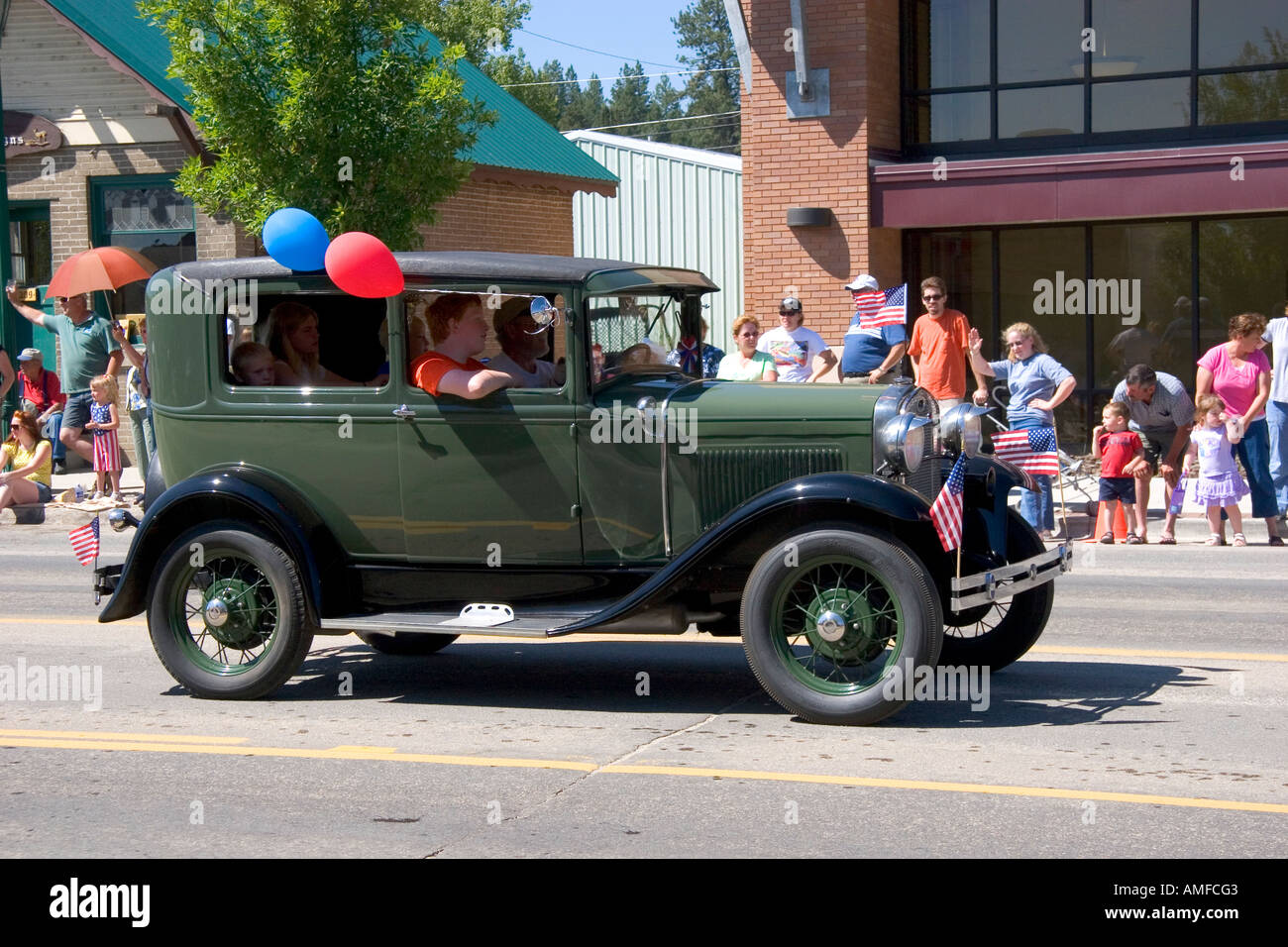 Antique automobile in a small town Fourth of July parade in Cascade