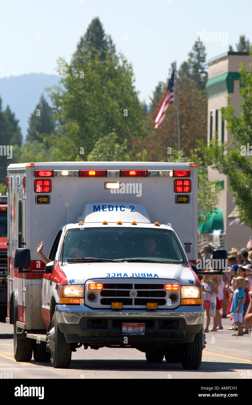 Ambulance driving in a small town Fourth of July parade in Cascade