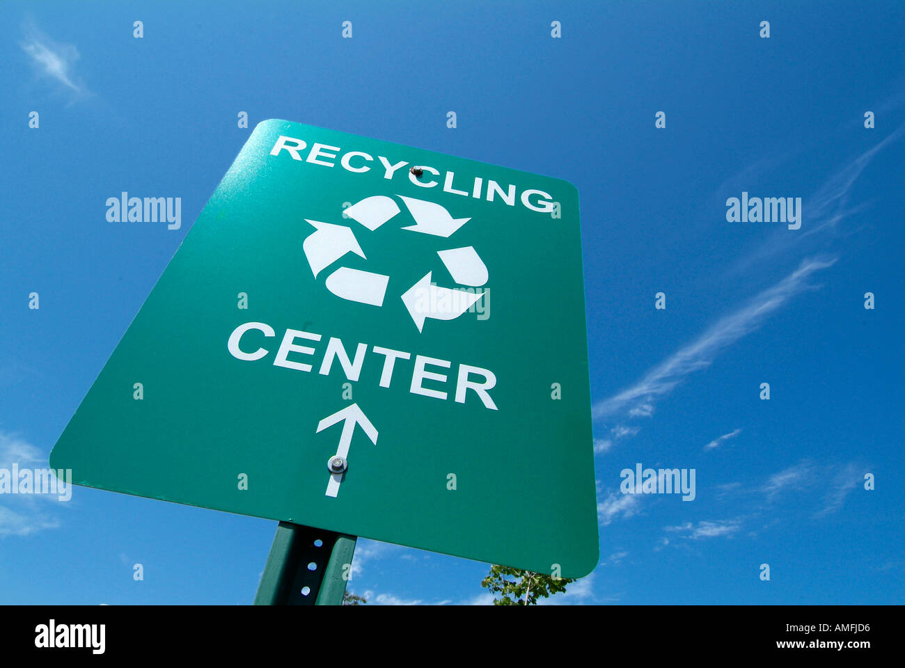 Highway sign showing the location and directions to a recycling center
