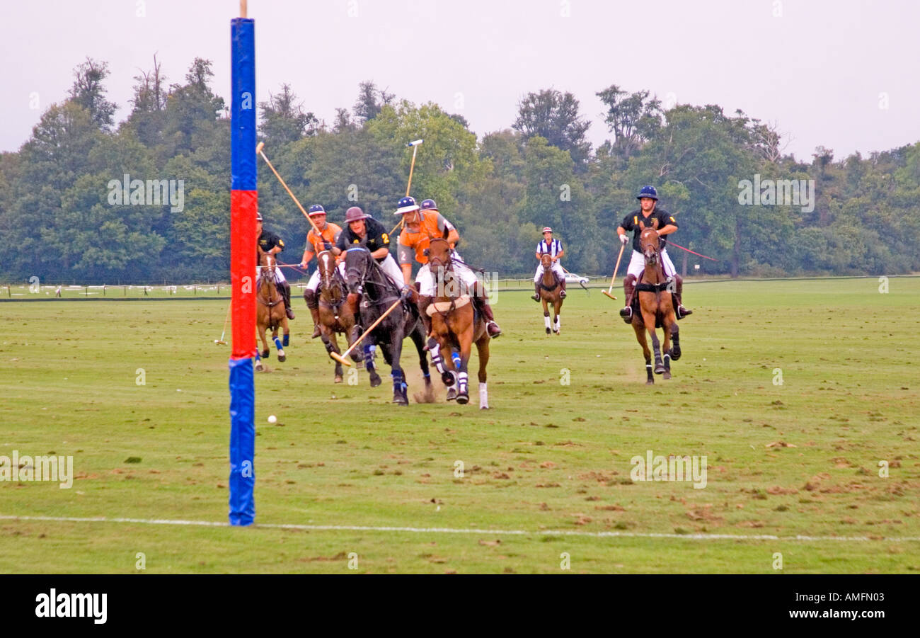 Players engaged in game of polo Guards Polo Club Smith s Lawn Windsor Berkshire Stock Photo