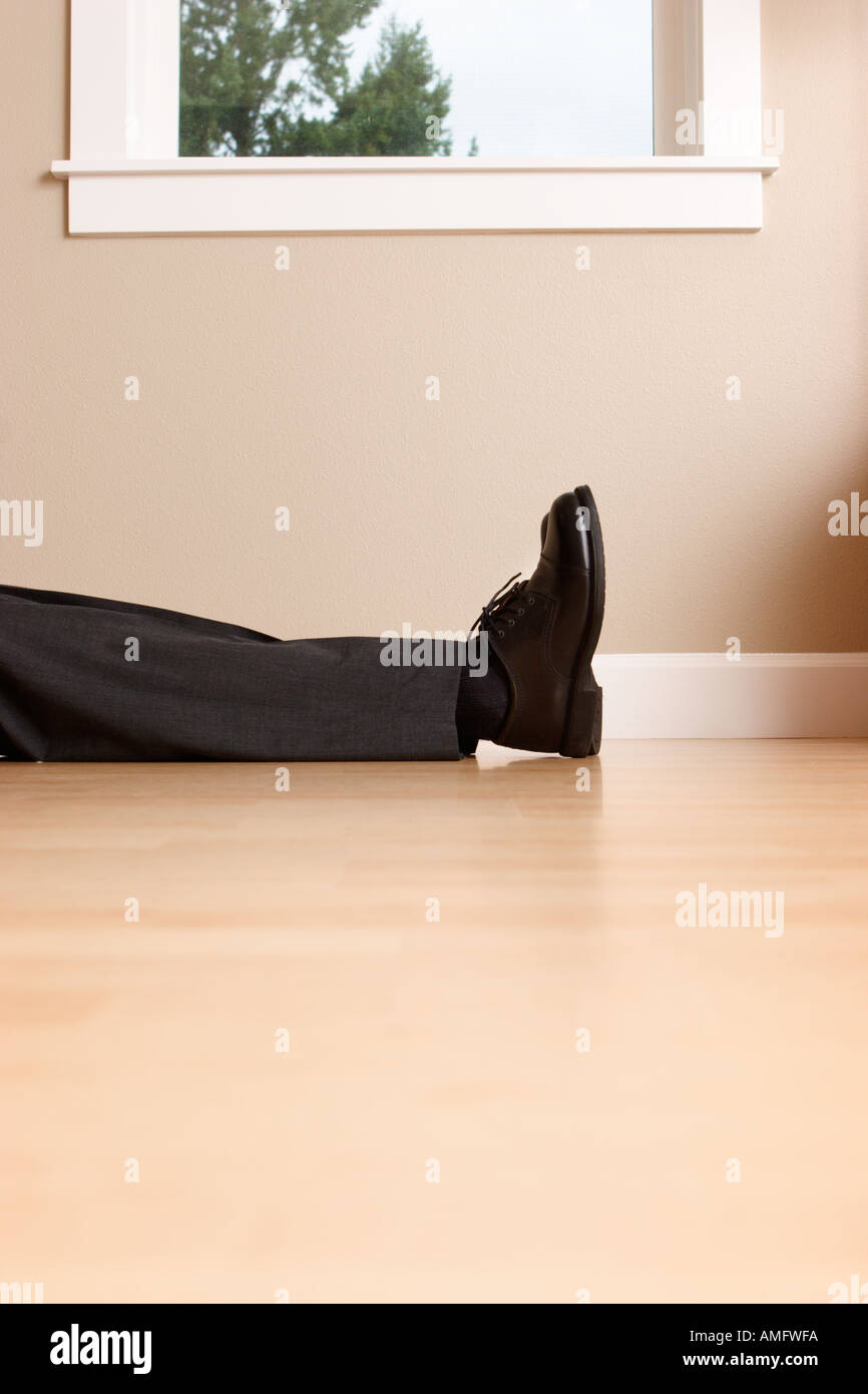 Person lying on floor hi-res stock photography and images - Alamy