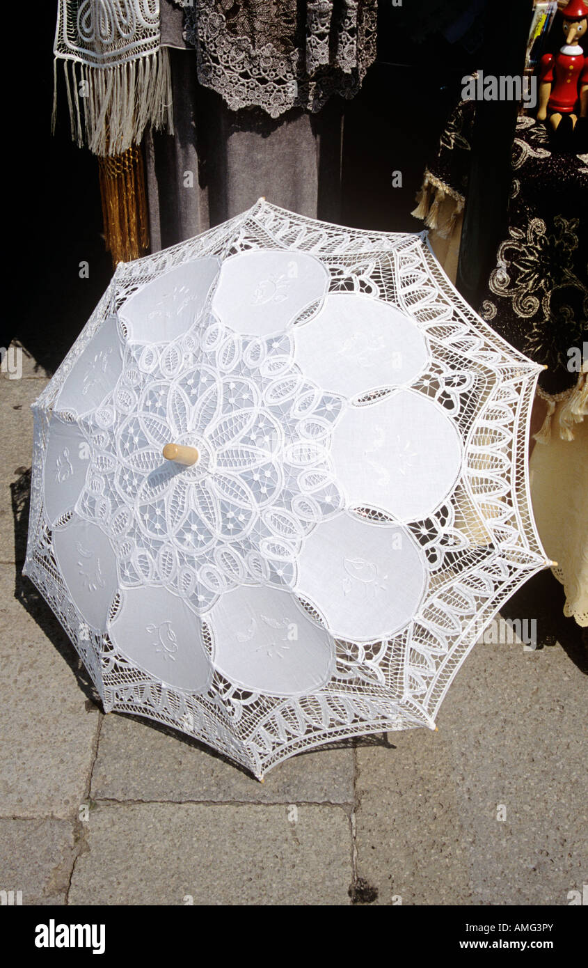Lace parasol for sale outside a shop on the island of Burano ...