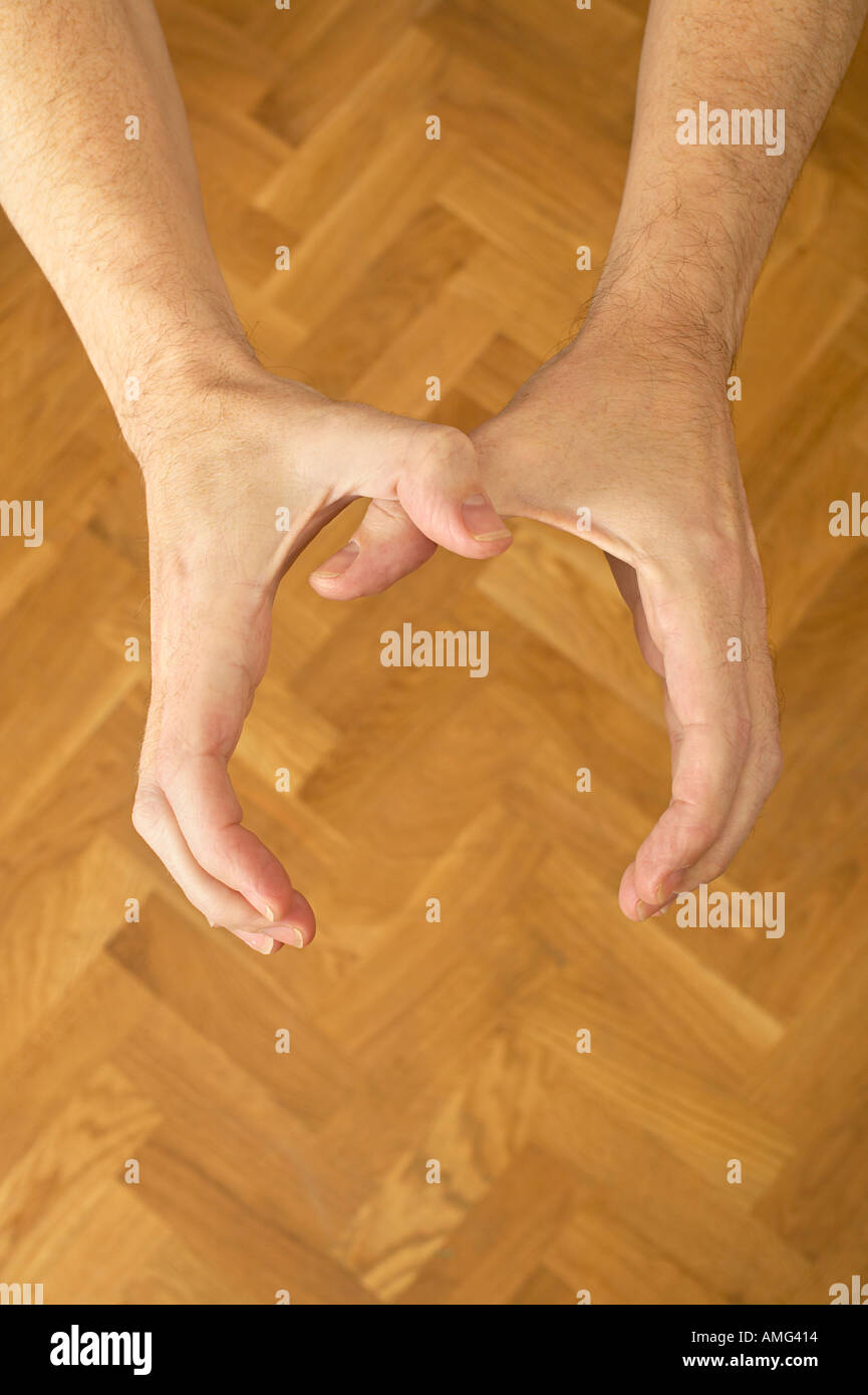 mans hands from above coming to strangle Stock Photo