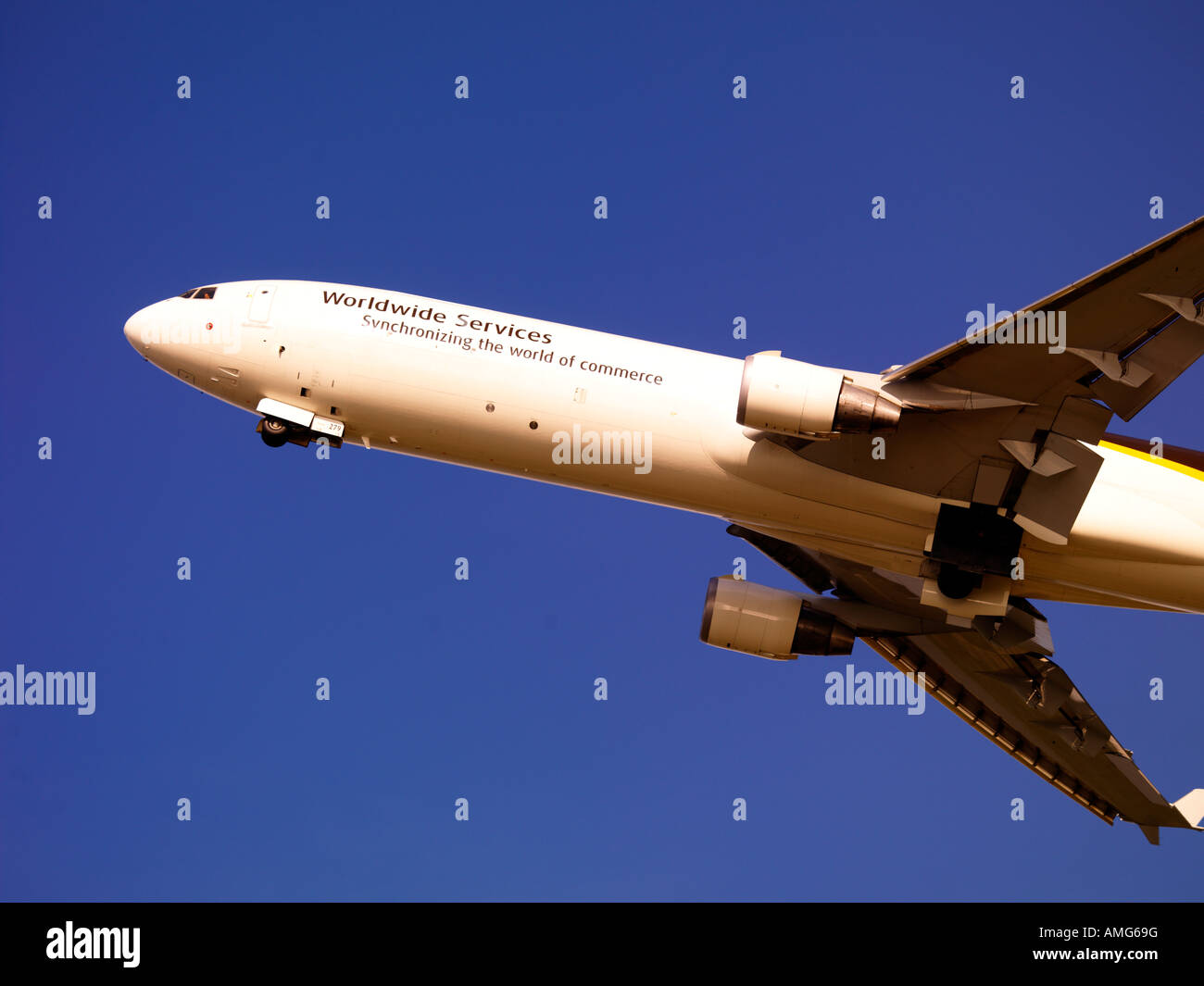 UPS MD-11 on takeoff from Anchorage with the Captain looking at the photographer. Stock Photo
