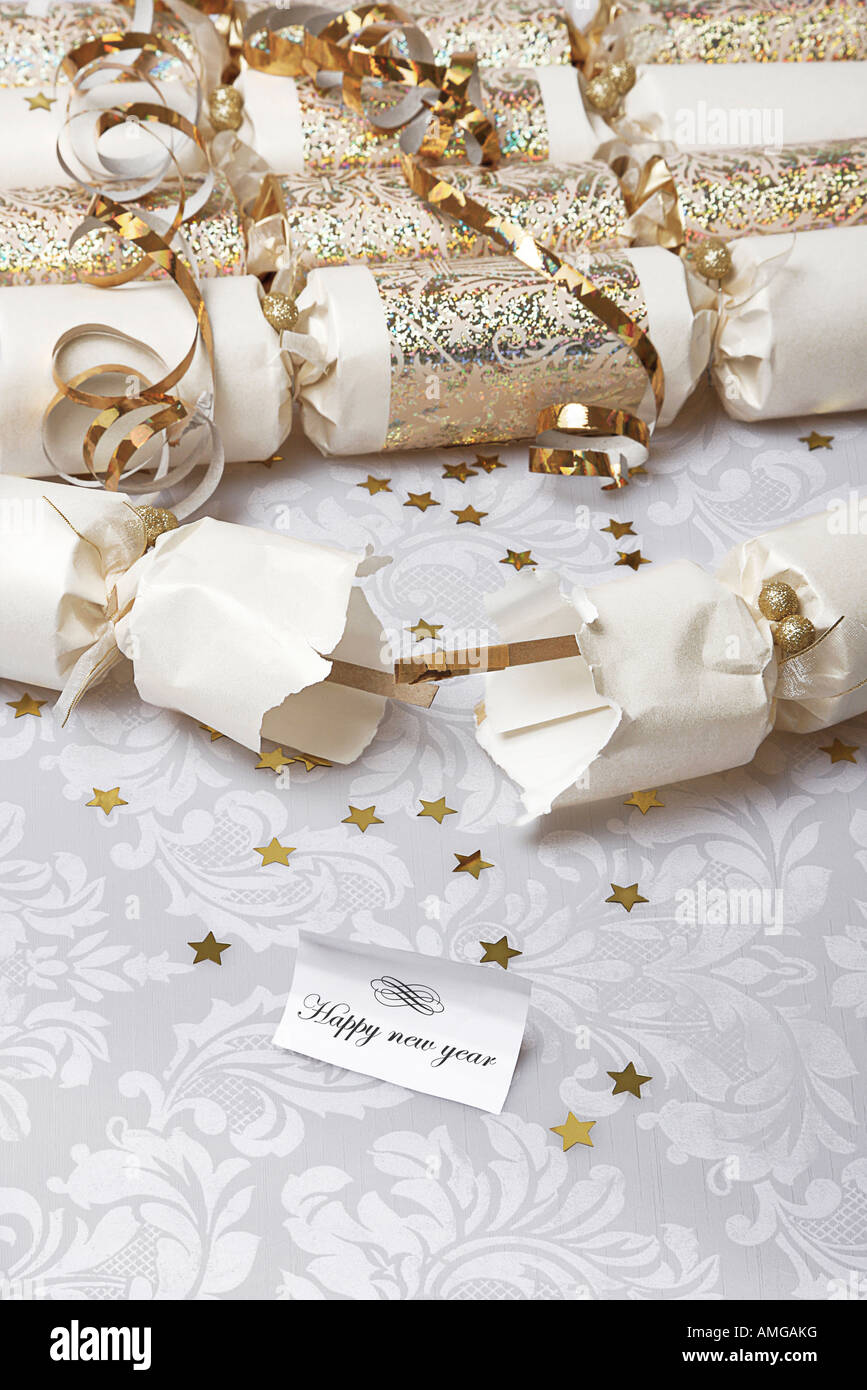 Festive party crackers with a Happy new year note Stock Photo