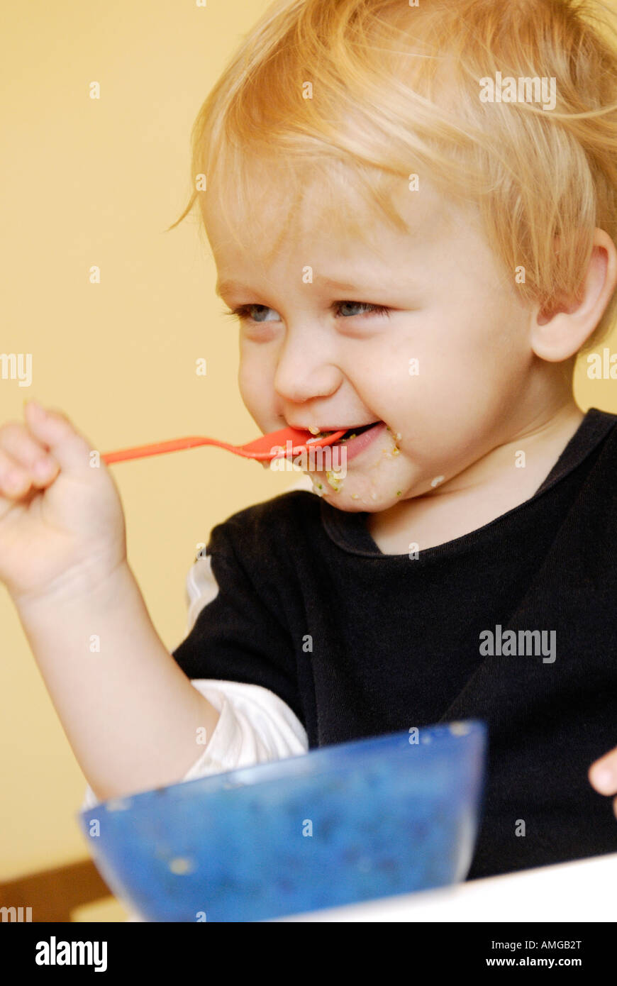 Baby boy eating Stock Photo Alamy
