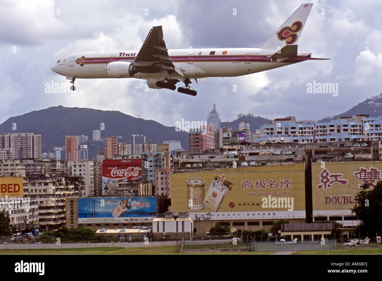 Plane landing at Kai Tak old airport Hong Kong SAR Stock Photo - Alamy