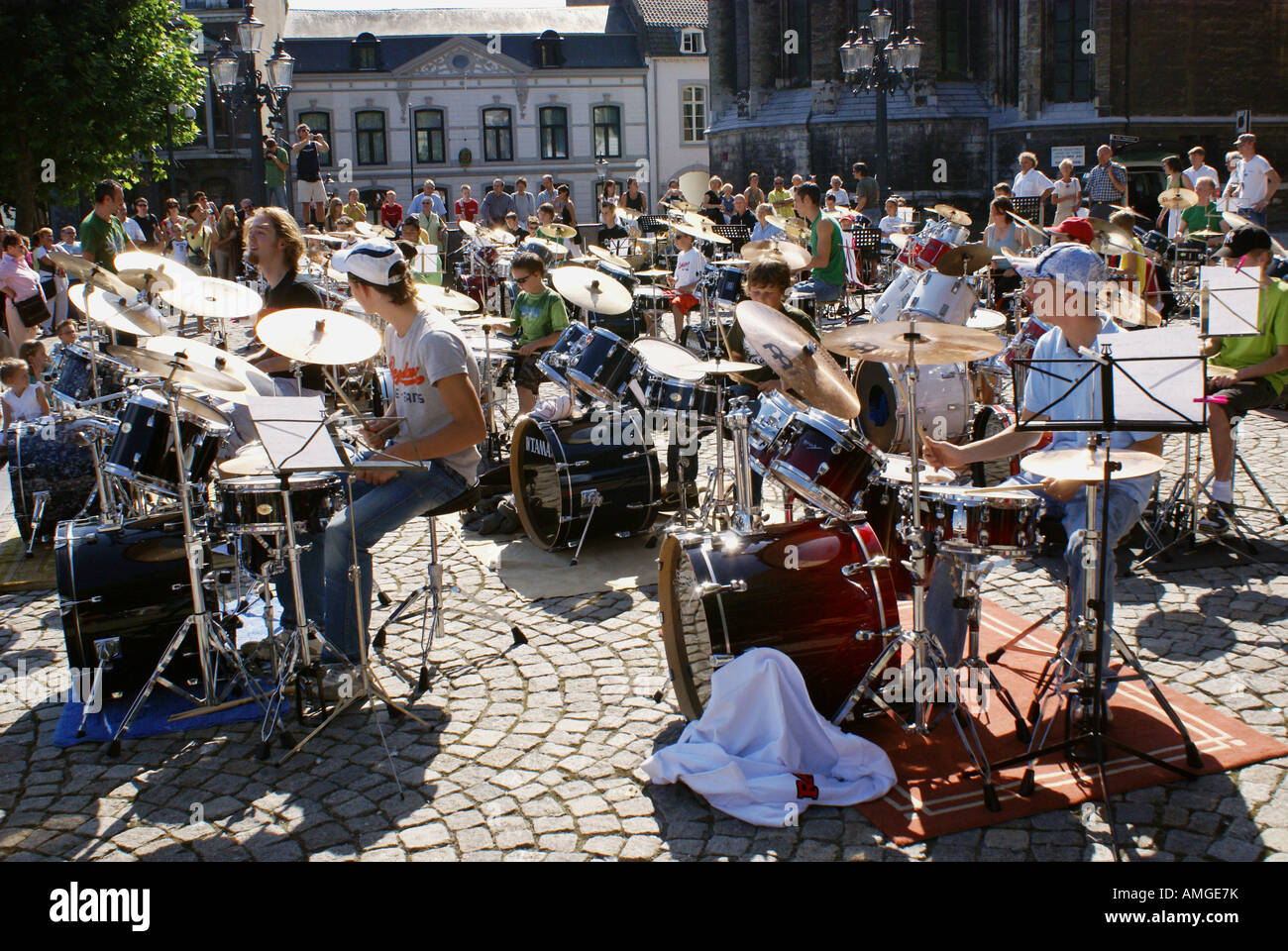 group of young musicians playing the drums at open air festival