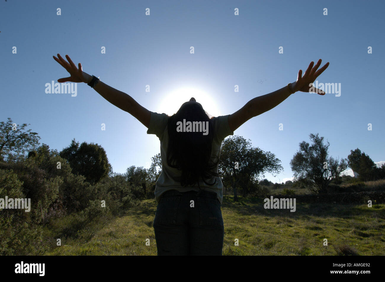 Mixed race young woman half asian half spanish standing against the sun