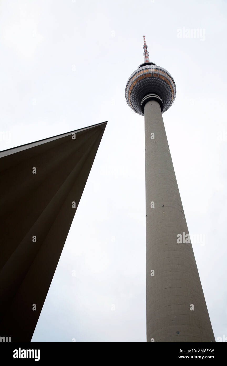 berliner fernsehturm Berlin TV tower symbol of east berlin with the roof of the nearby pavilion Germany Stock Photo