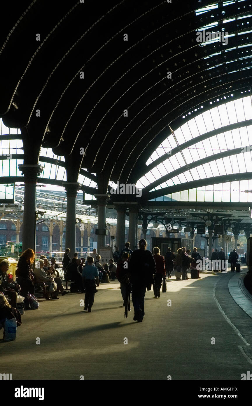 Passengers waiting for a train on York station Stock Photo