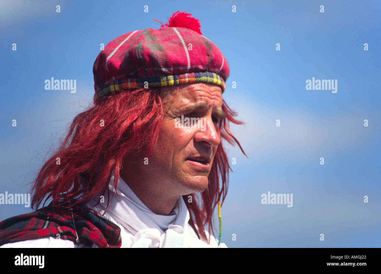 Street entertainer wearing a Scottish Tammy hat, or a See You Jimmy hat, with red hair Stock Photo