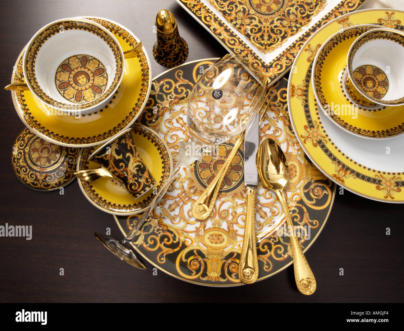 Versace designed dinner service dishes glasses bowls by Rosenthal with gold  Versace cutlery tableware Stock Photo - Alamy