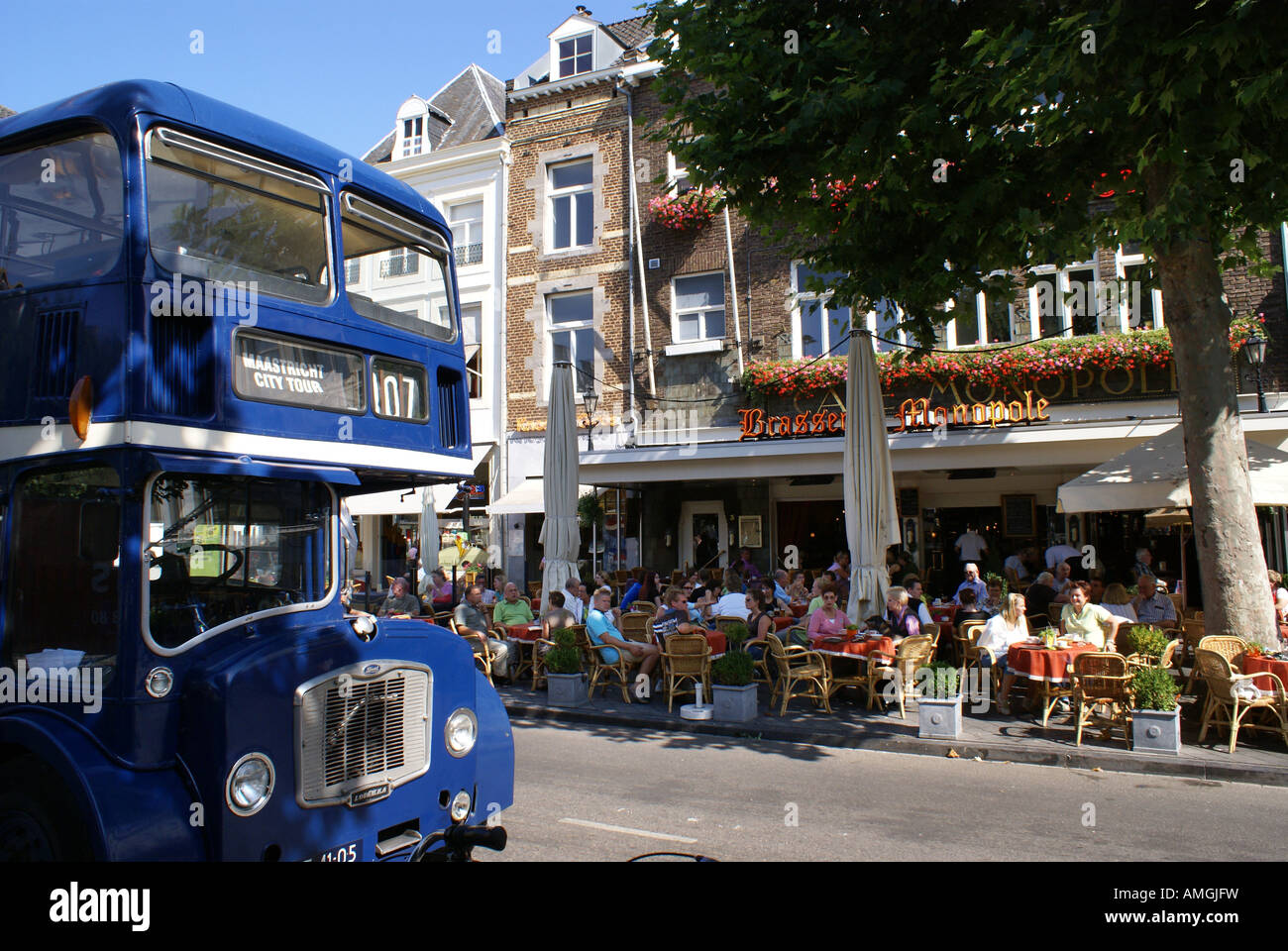 Vrijthof Maastricht with terraces people and blue doubledecker Stock Photo