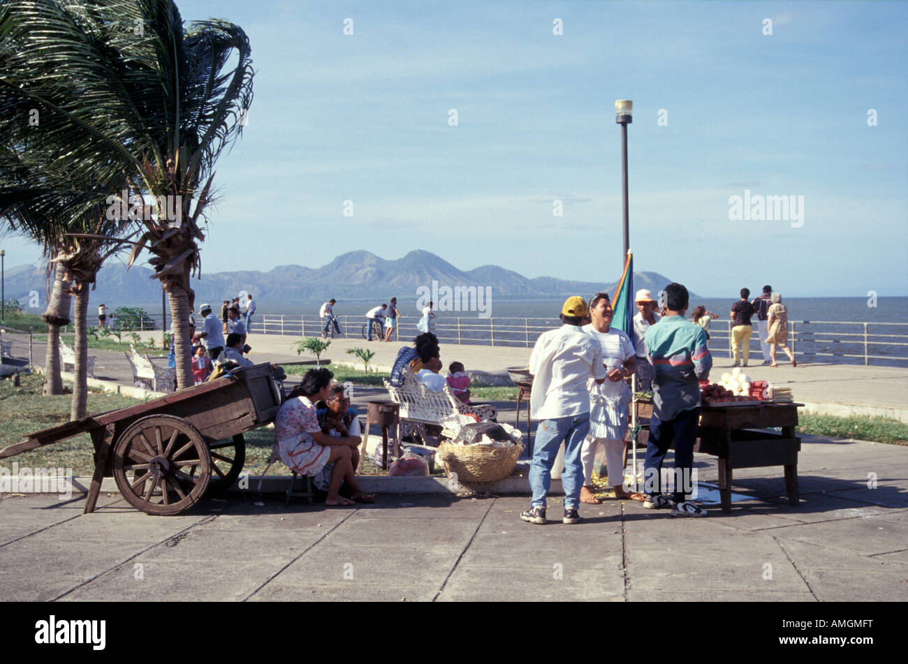 People relaxing and chatting on the the Malecon pedestrian promenade, Managua, Nicaragua. Stock Photo