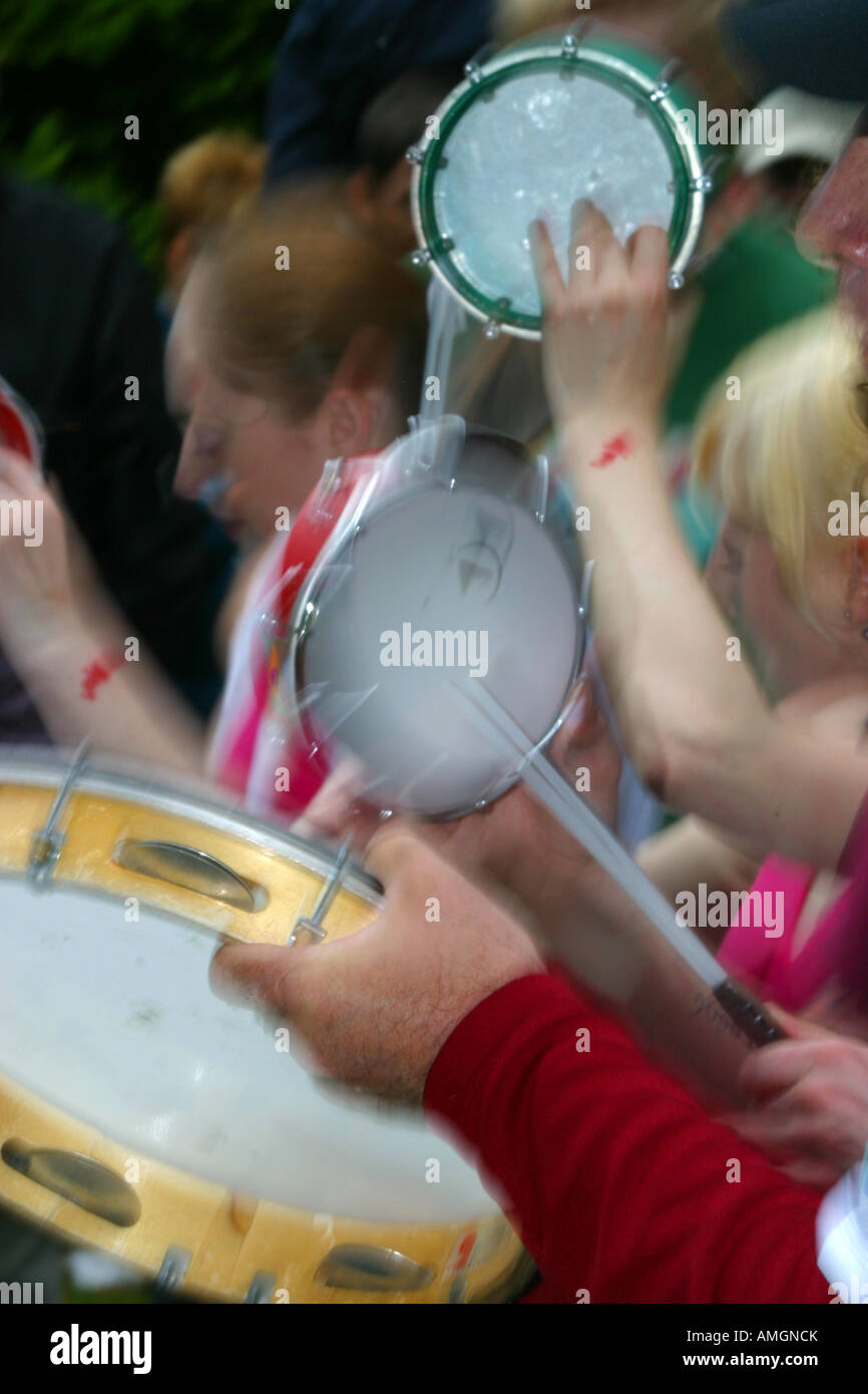 Tambourines shaking with drumsticks Stock Photo Alamy