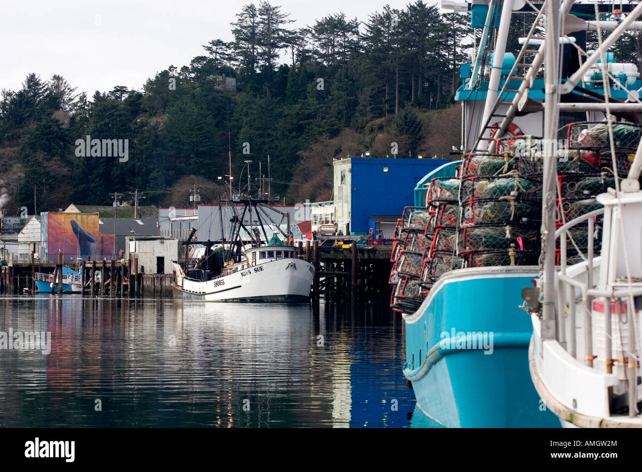 Commercial fishing boats loaded with crab pots in Newport Oregon Stock
