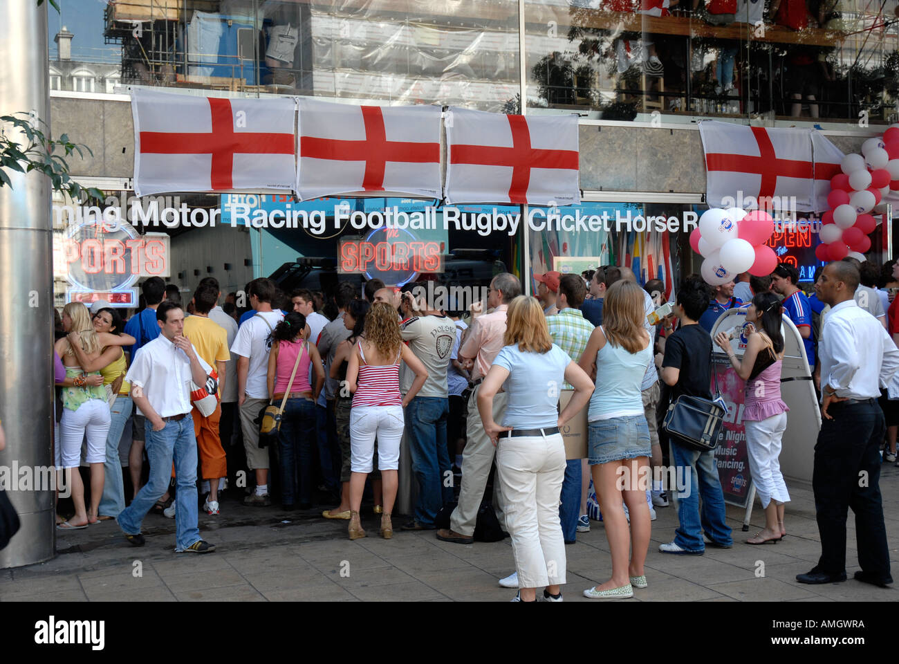 People watching a 2006 World Cup football match outside The Sports Café in Haymarket London Stock Photo