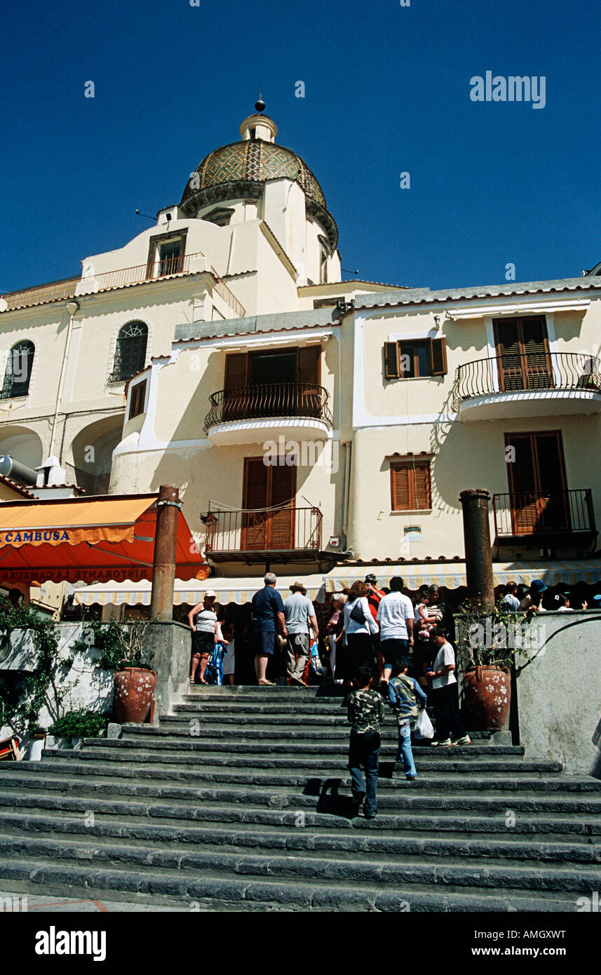 Tourists in front of Santa Maria Dell Assunta Church and apartments, Positano, Amalfi Coast, Campania, Italy Stock Photo