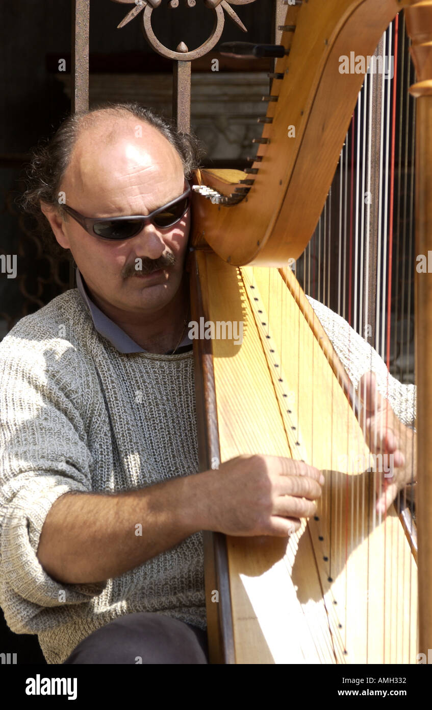 Harp player in San Gimignano Italy Stock Photo Alamy