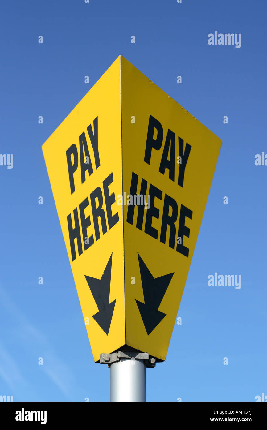 Pay Here sign and direction arrow Stock Photo Alamy