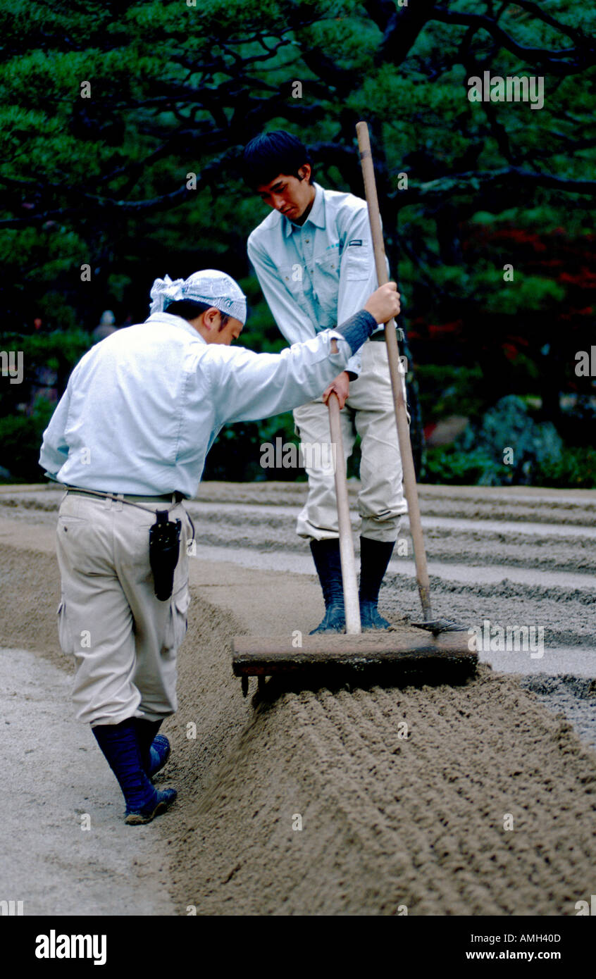 "Gardeners raking a new zen garden at Ginkakuji Silver Zen Garden Kyoto