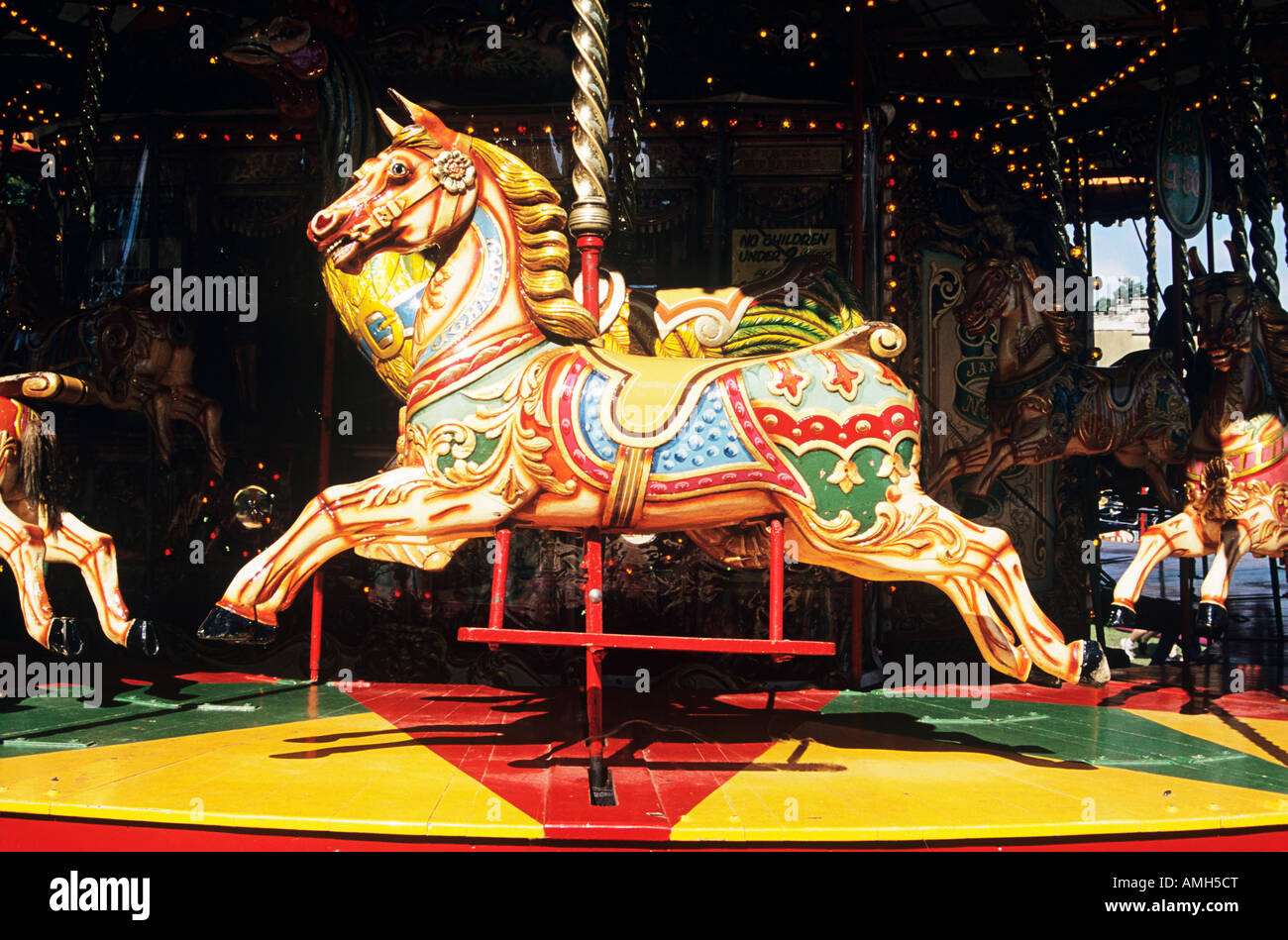 Colourful painted horse on fairground carousel, England Stock Photo