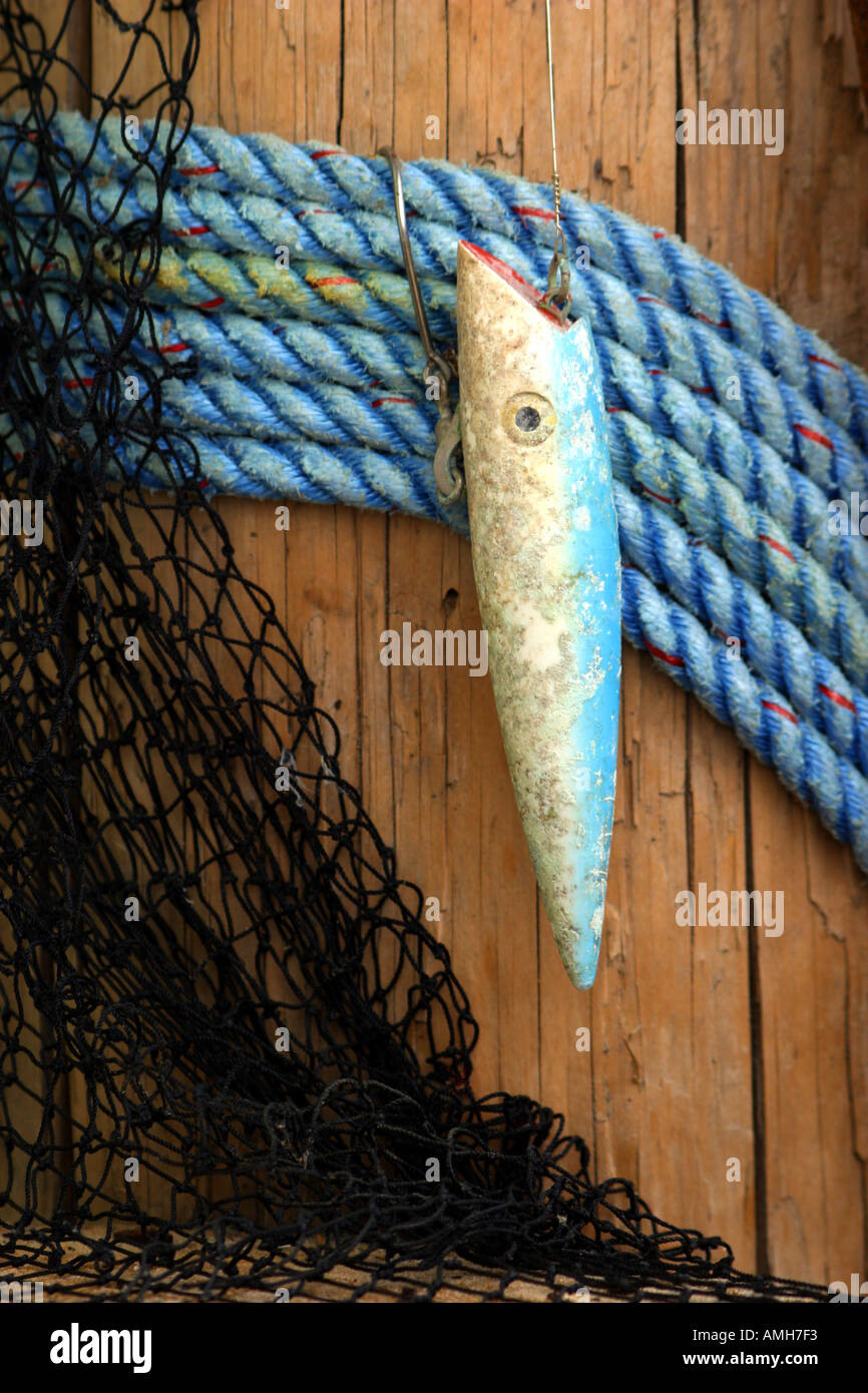 https://c8.alamy.com/comp/AMH7F3/fishing-lure-used-as-nautical-decoration-on-piling-AMH7F3.jpg
