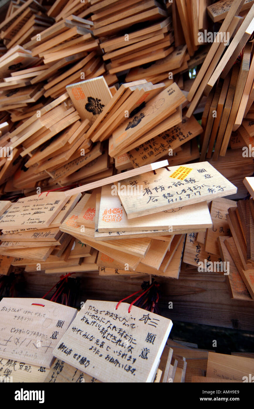 Prayers & messages left on wooden plaques at a shrine in Yoyogi koen park Tokyo Japan Stock Photo