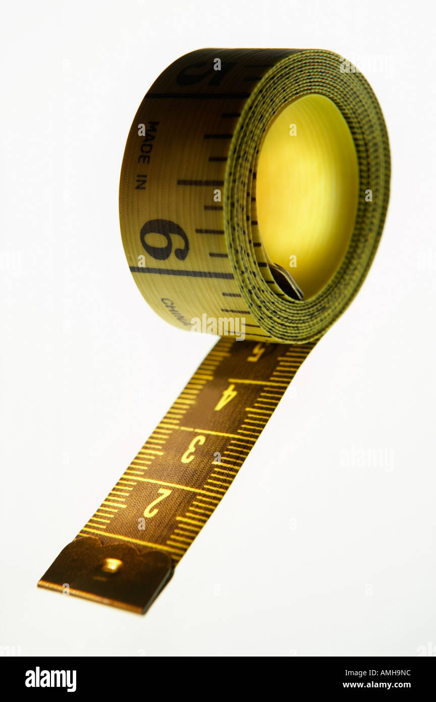 Rolled up red tape measure hi-res stock photography and images - Alamy