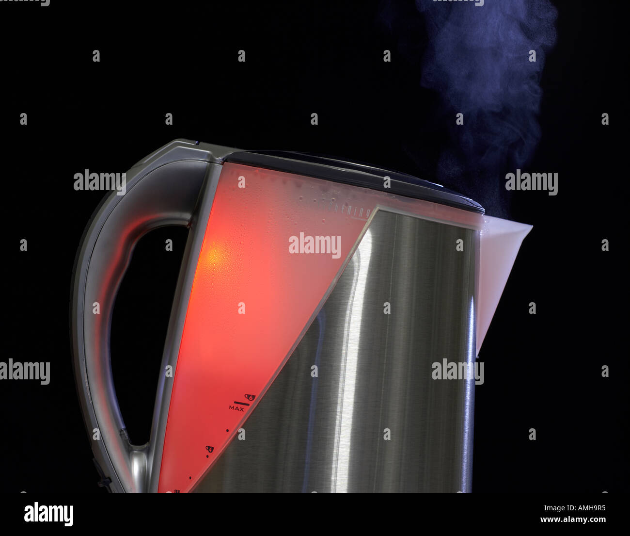 MODERN STAINLESS STEEL KETTLE WITH RED LIGHT INSIDE AND STEAM FLOWING FROM SPOUT Stock Photo Alamy