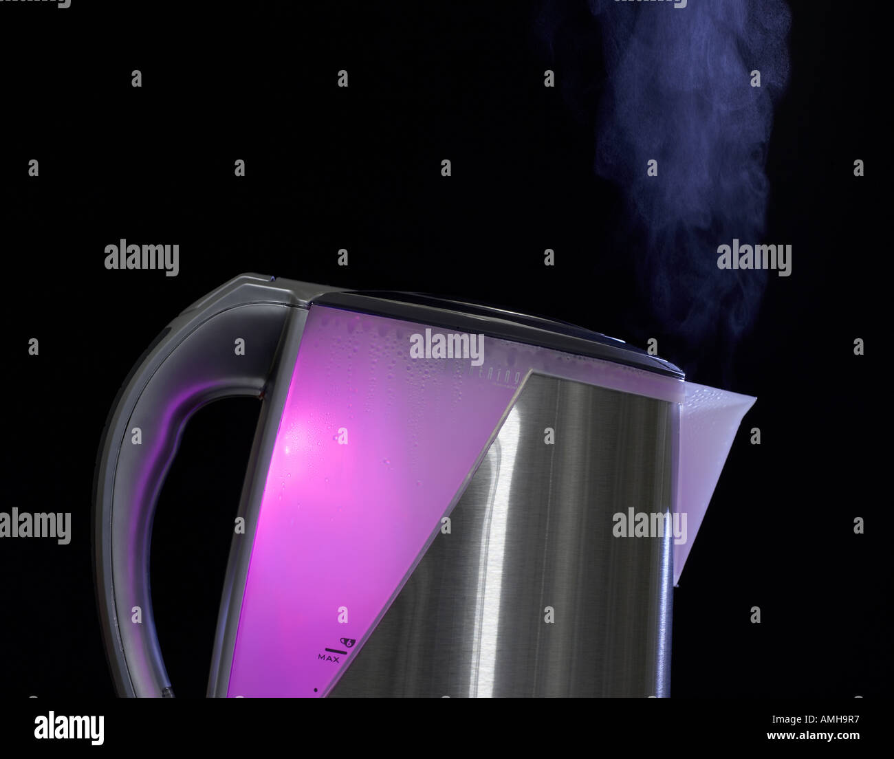 MODERN STAINLESS STEEL KETTLE WITH PINK LIGHT INSIDE AND STEAM FLOWING