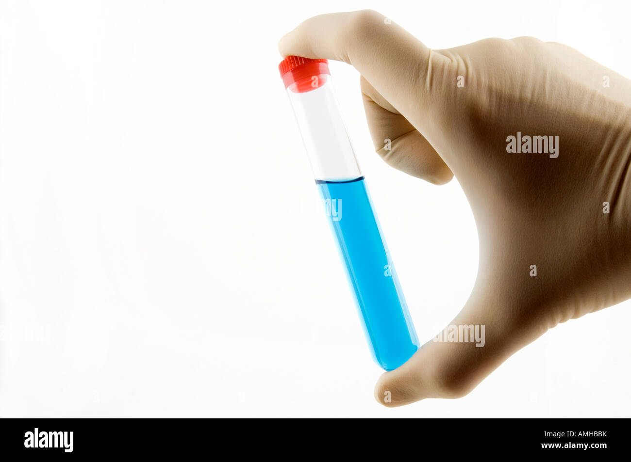 hand holding a test tube with blue liquid Stock Photo - Alamy