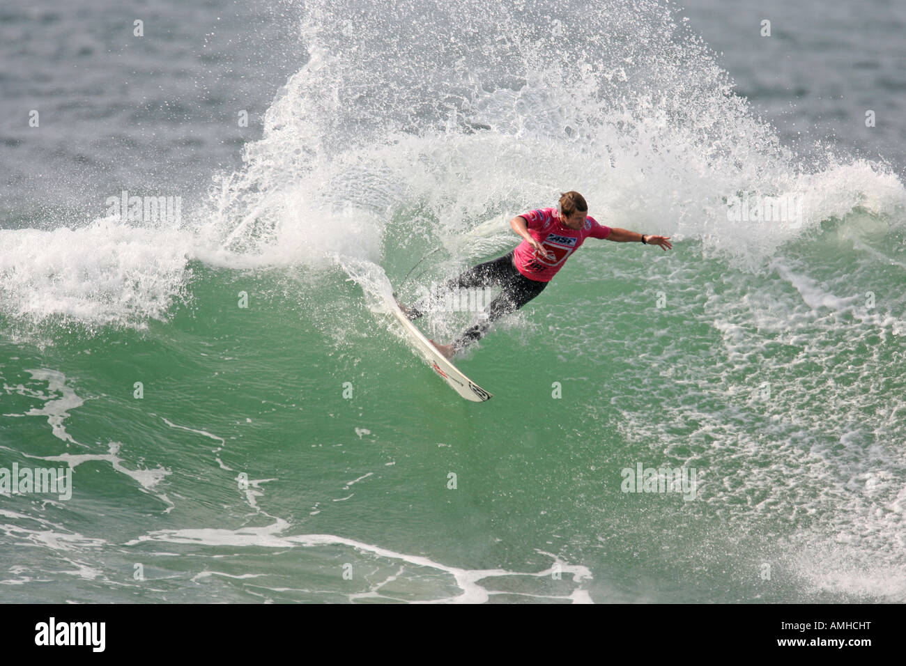 A Surfer rides a Wave Stock Photo - Alamy