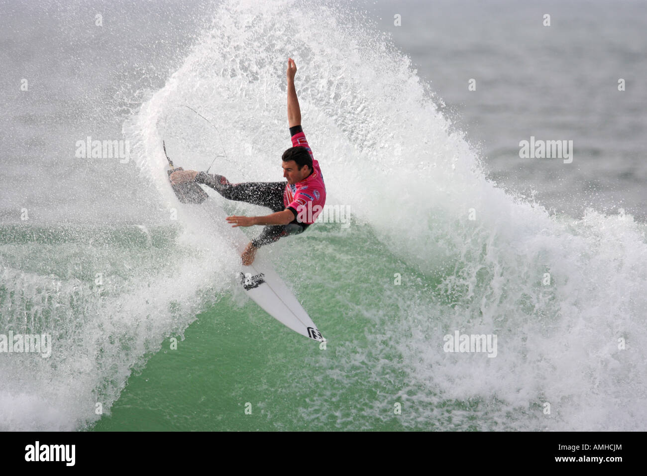 A Surfer rides a Wave Stock Photo - Alamy