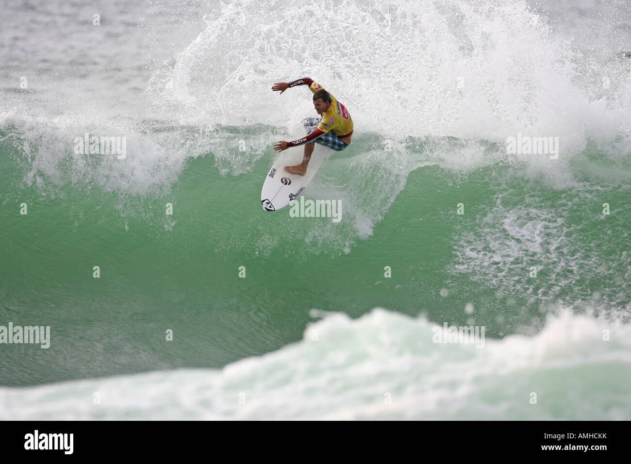 A Surfer rides a Wave Stock Photo - Alamy