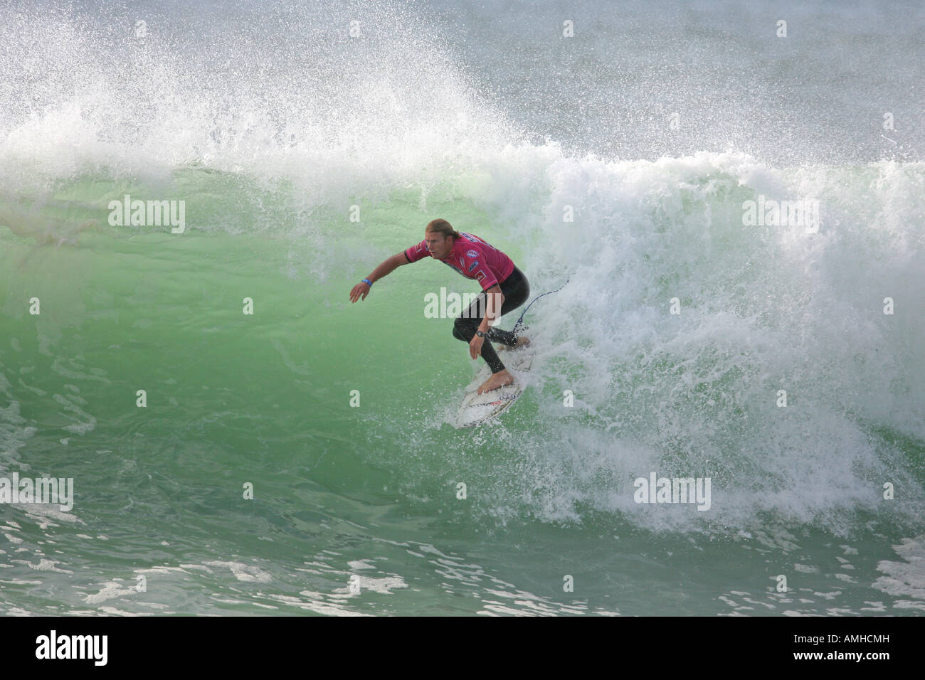 A Surfer rides a Wave Stock Photo - Alamy