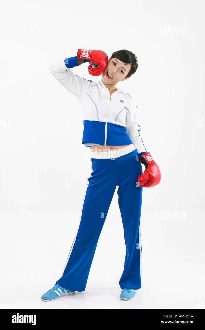 A woman with boxing gloves makes funny gesture Stock Photo