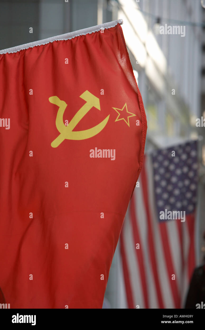USSR red hammer and sickle flag next to US stars and stripes in border area of berlin Stock Photo